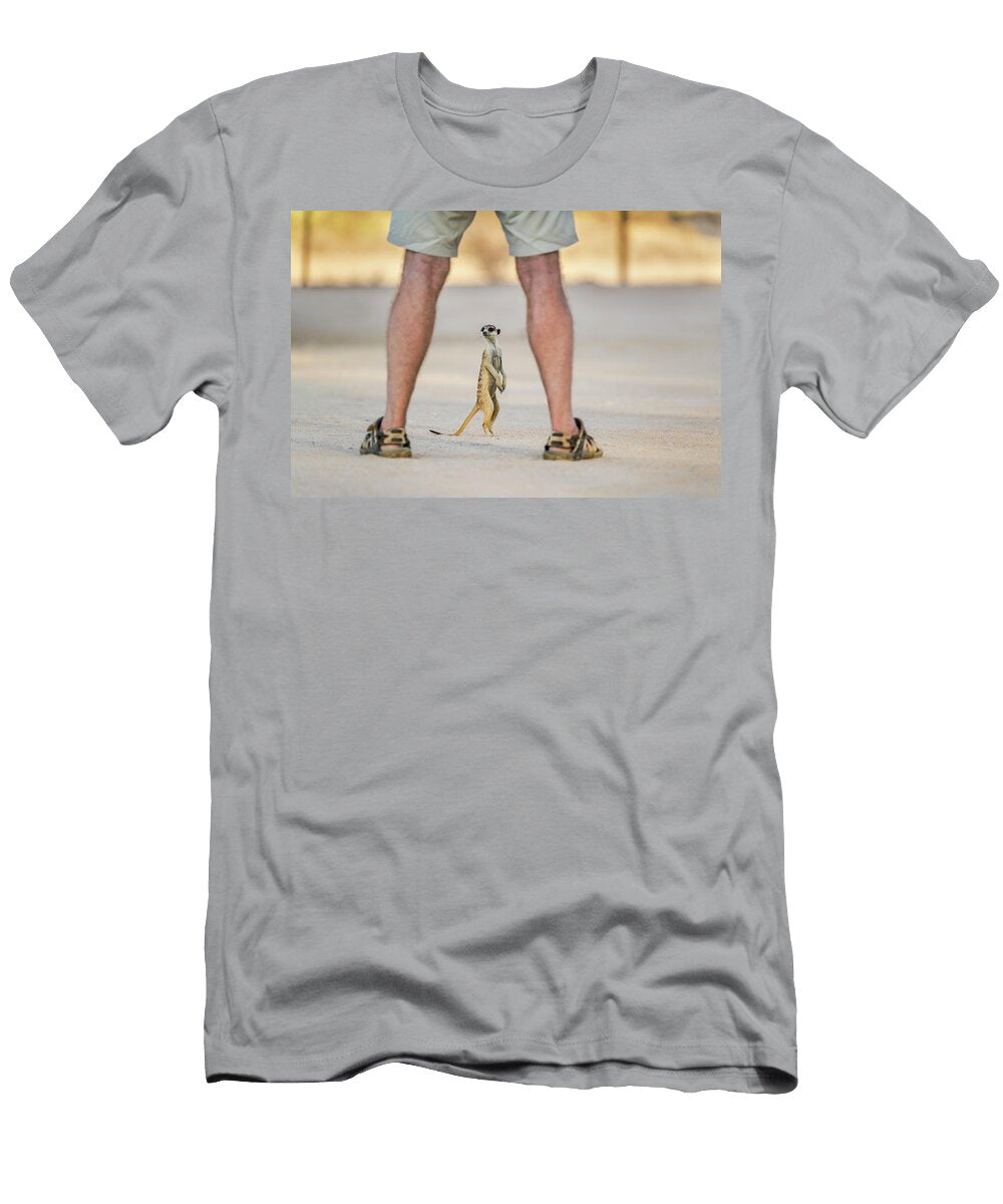 Meerkat At Campsite Seen Through Legs of Tourist Kgalagadi Ann Steve Toon Natureplcom T-Shirt